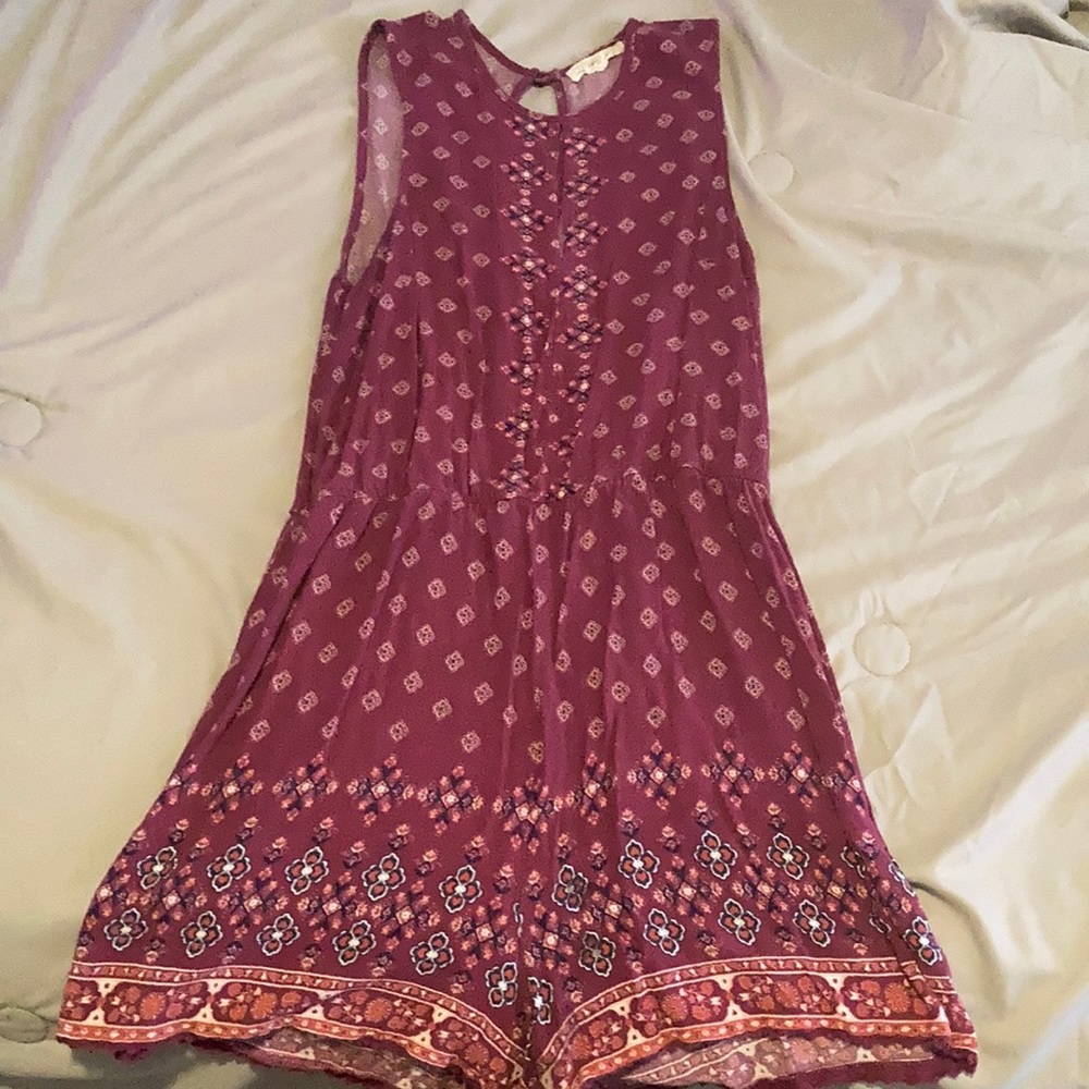 Pink romper with flower designs